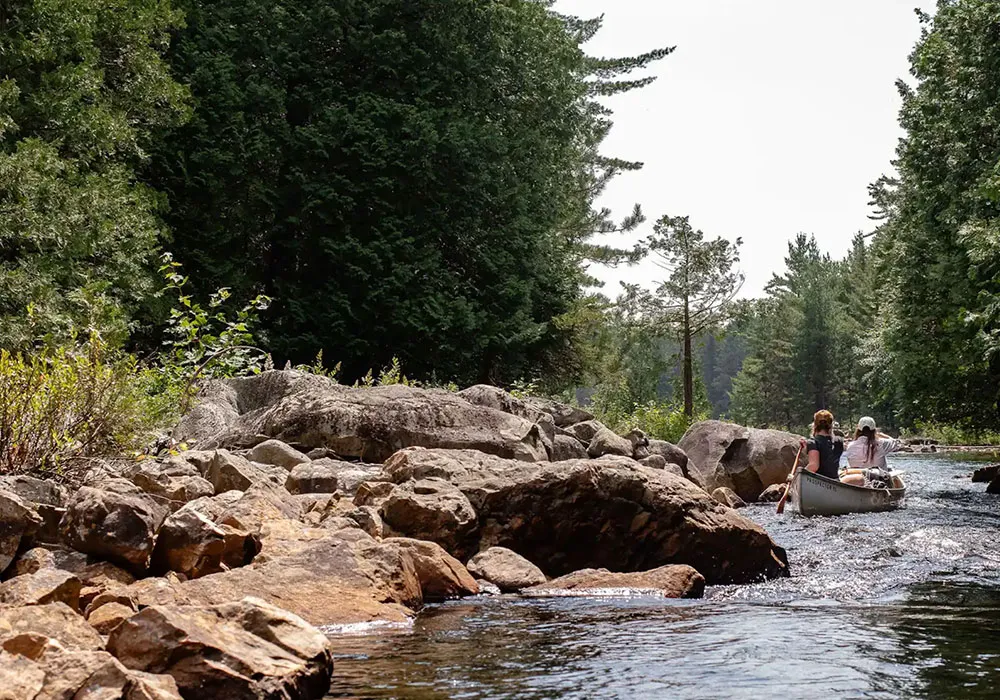 Two women Paddle the cool, deep lakes and old growth forests of Temagami Ontario