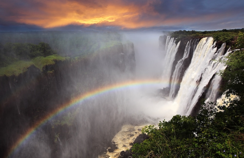 rainbow over victoria falls zambia